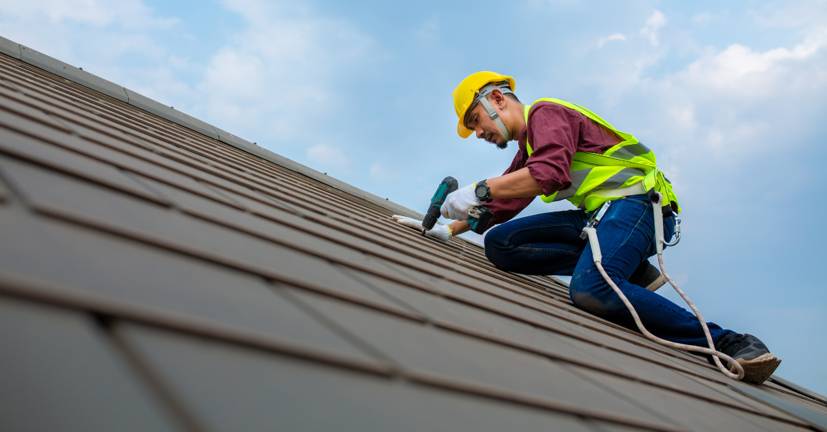 workman repairing roof